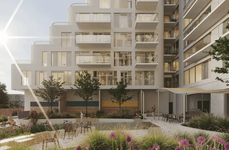 Modern residential building with curved facade and balconies, overlooking a landscaped courtyard with people and purple flowers.