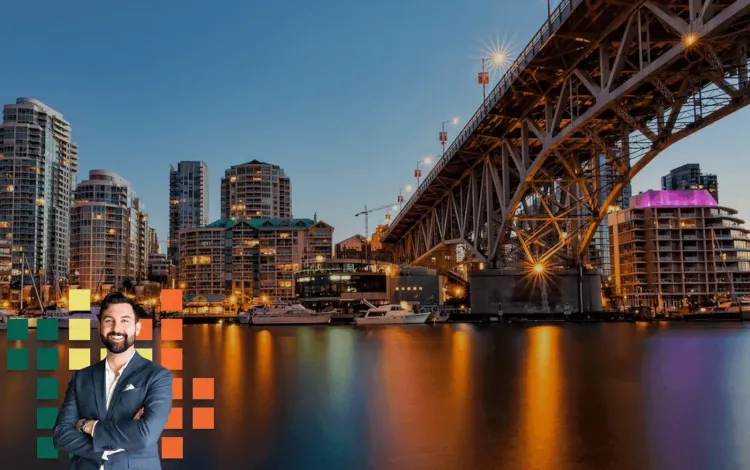 Smiling man in a suit over a dusk city skyline with a lighted bridge and water reflections, framed by colorful pixels.