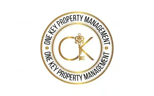 One Key Property Management logo. Gold circle with company name and "CK" where the K is a vintage key.
